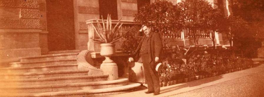 Albert Raymond in front of the historical family mansion